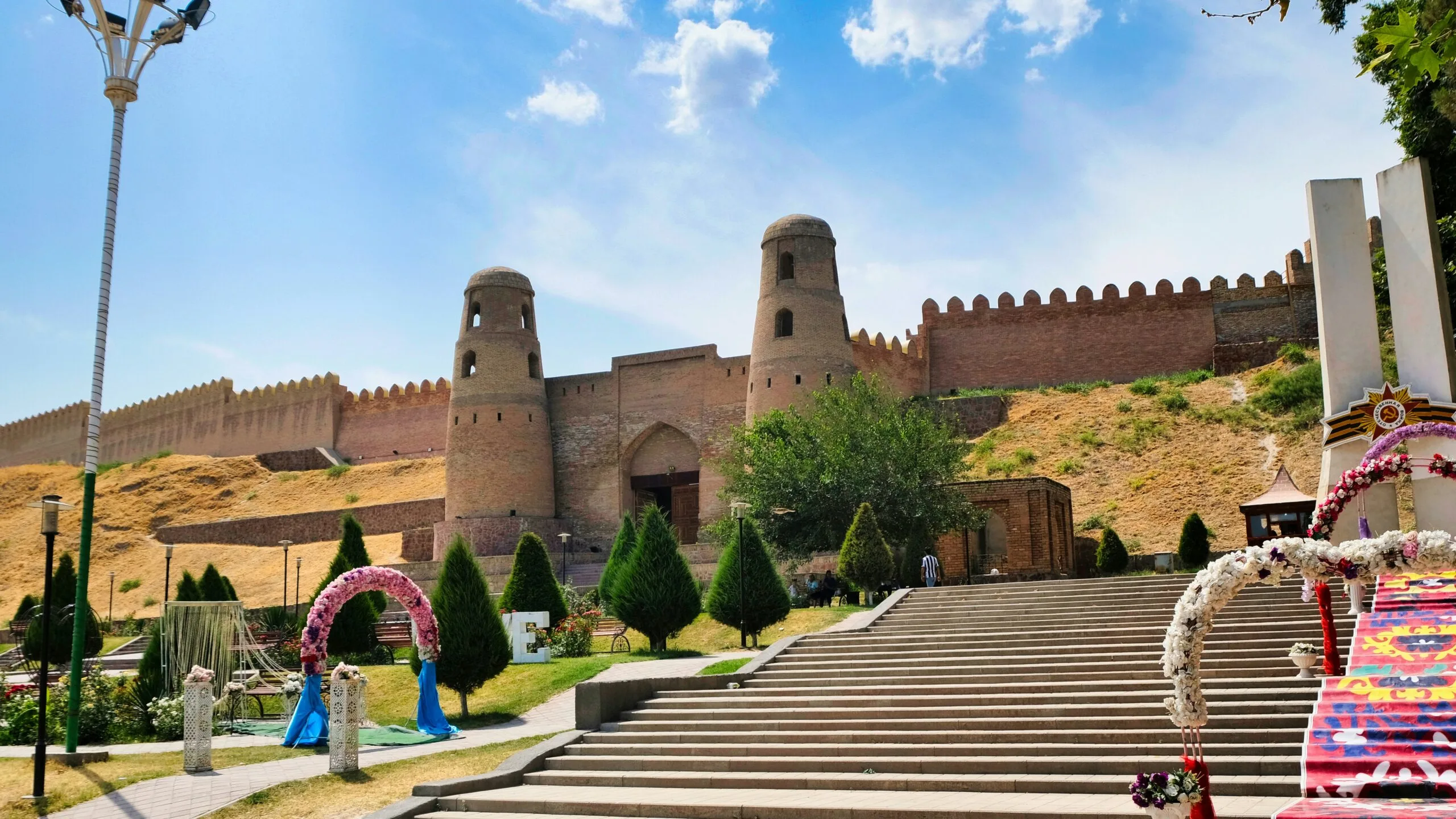 Ancient fortress walls and building in a sunny landscape