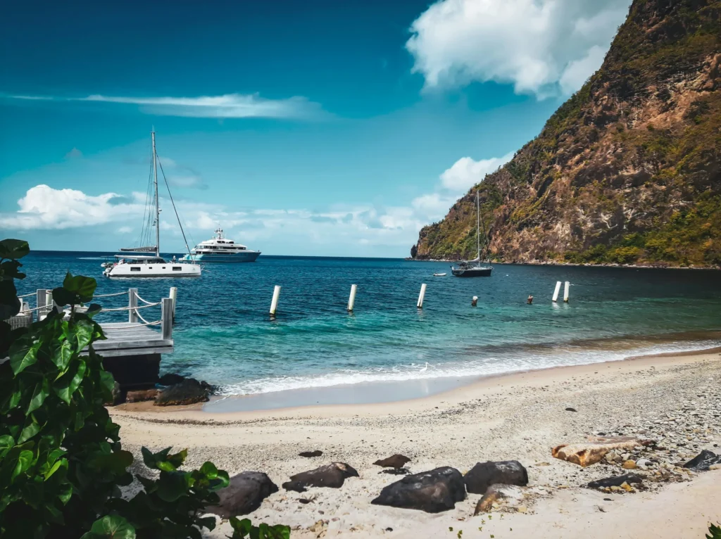Beach with boats and The Pitons in the background