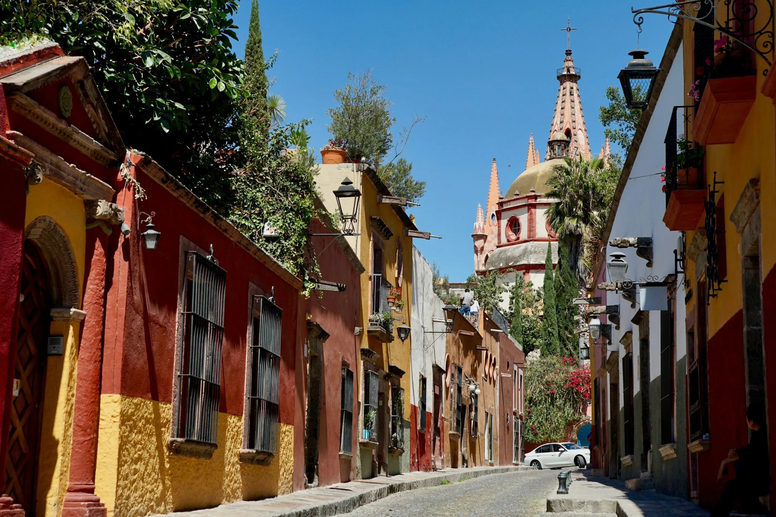 A colorful street with colonial architecture in a Mexican town.