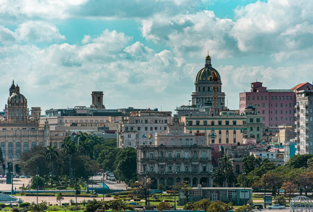A wide view of the El Capitolio building and surrounding cityscape in Havana, Cuba.