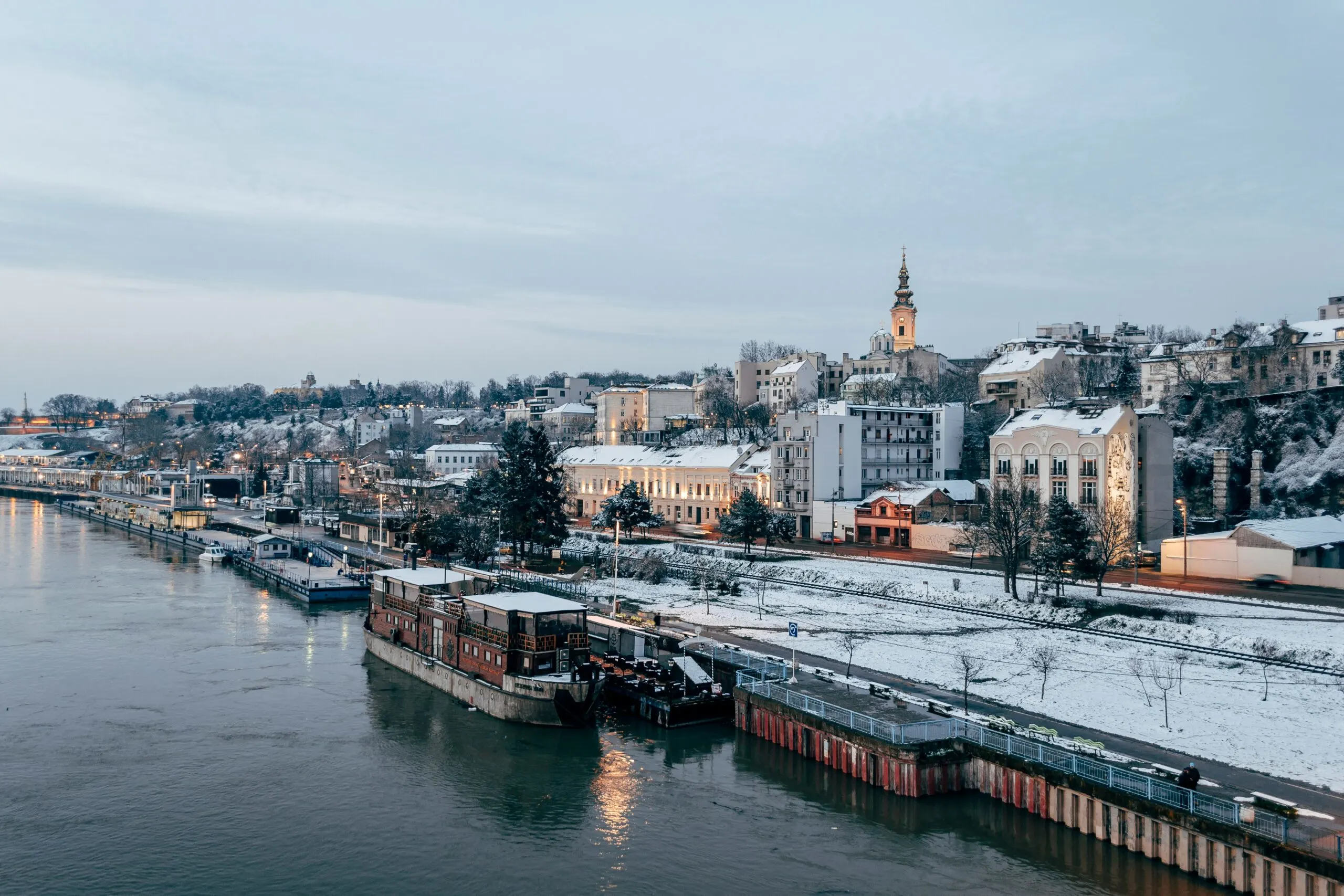 Belgrade, Serbia in winter with a river and buildings