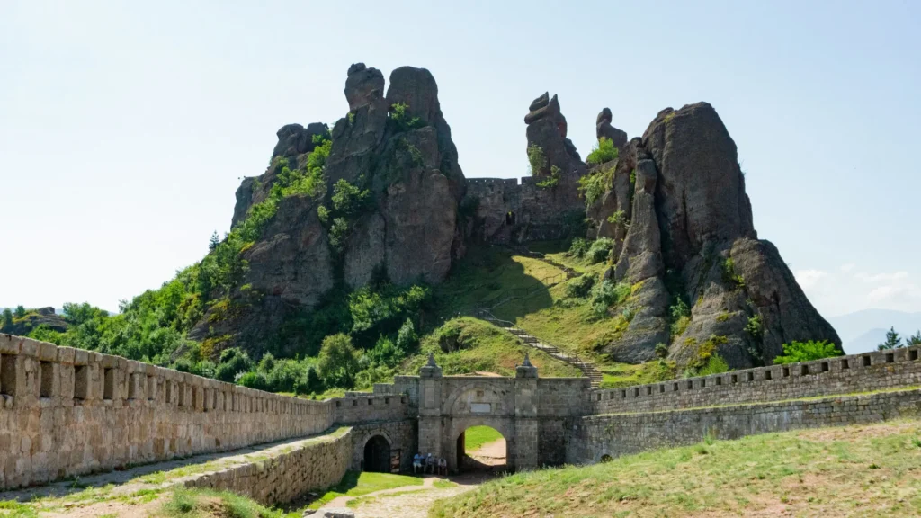 Ancient ruins on a hill with a stone wall