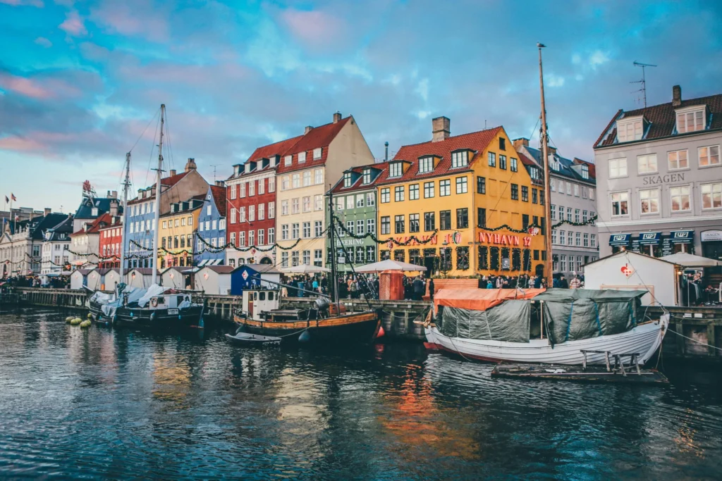 A picturesque harbor in Copenhagen with colorful buildings and boats.