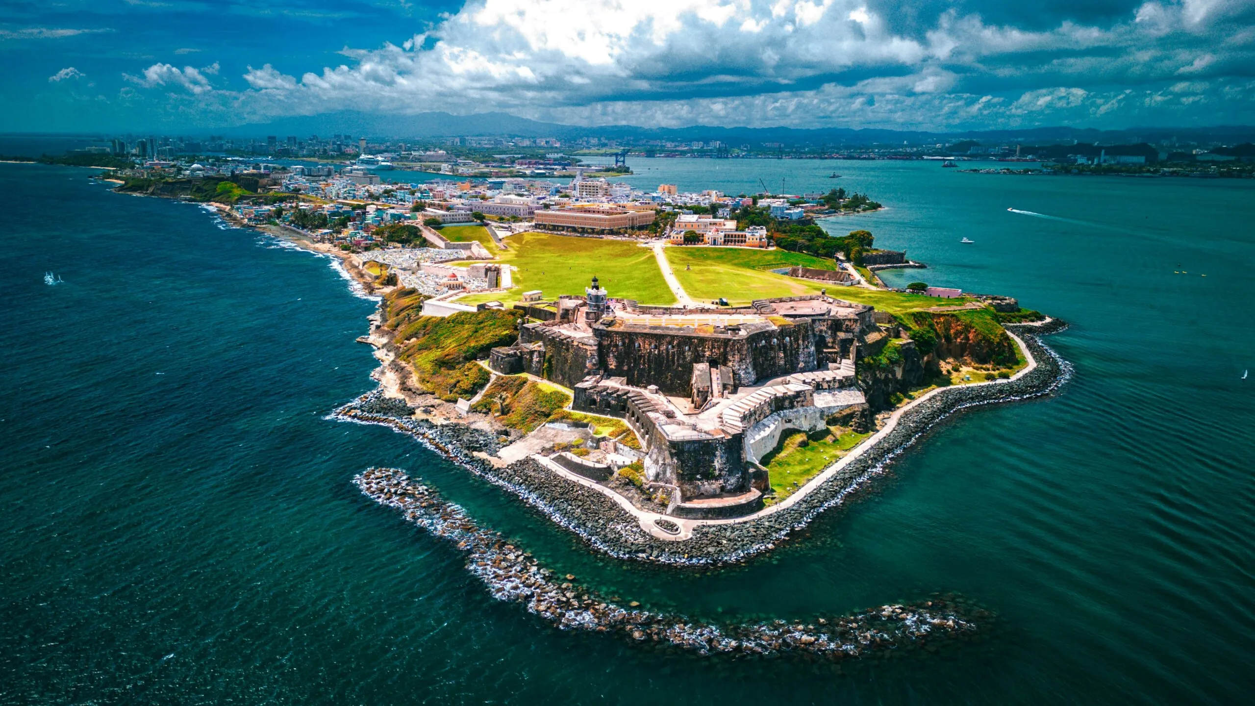 An aerial view of a large historical fort surrounded by water.