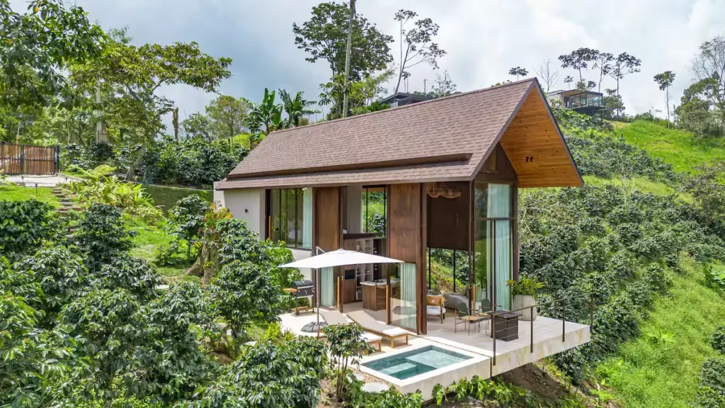 Off-season tropical hillside travel retreat cabin with private plunge pool terrace in lush green forest